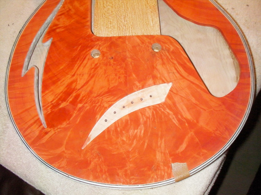 Firebolt in Tangerine Flame Maple with White MOP Purfling and Snakewood Fretboard9
