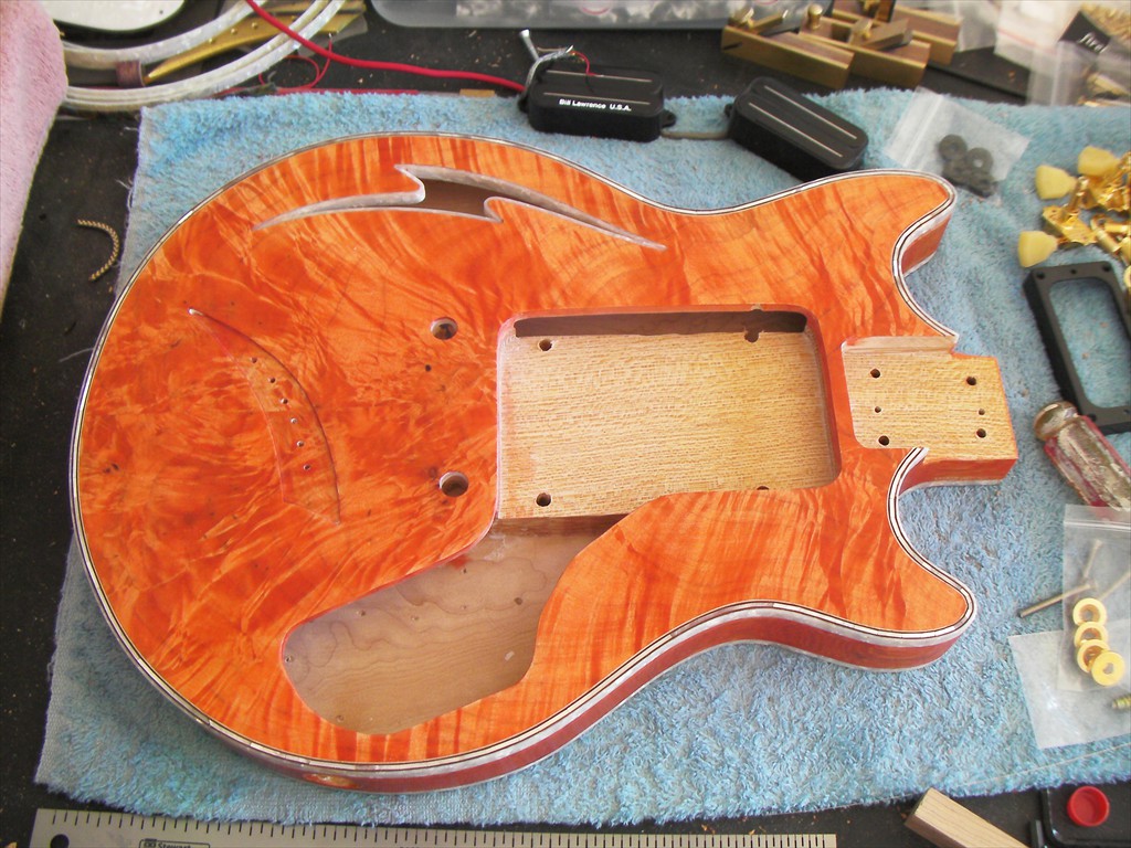 Firebolt in Tangerine Flame Maple with White MOP Purfling and Snakewood Fretboard